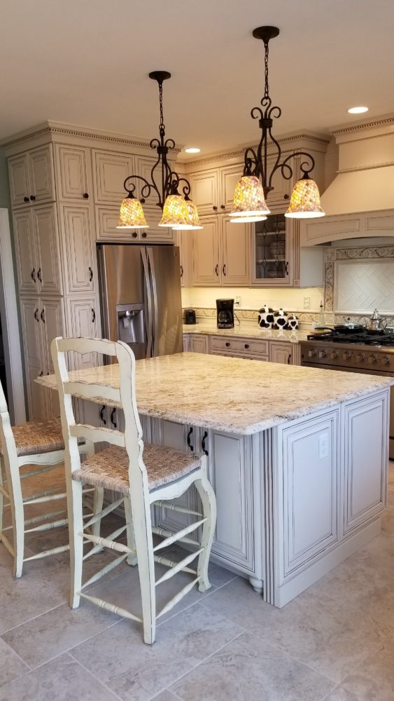 A white kitchen with an island